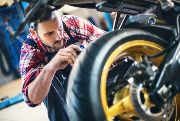 Close-up of motorcycle being serviced